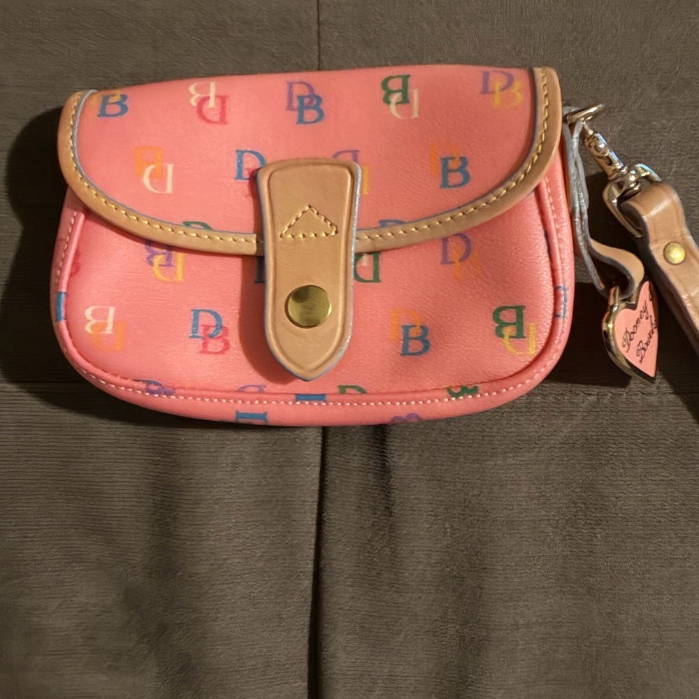 Dooney & Bourke Pink wristlet with pink heart charm